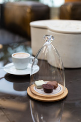 sweets under a glass cover, a sweet gift for coffee