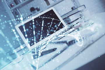 Desktop computer background and DNA drawing. Double exposure. Science concept.