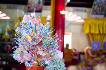 Thai bank notes on trees that were created for plugging in donations or making merit in Buddhism in Thailand.