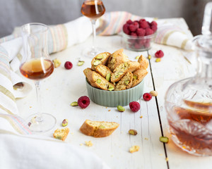 biscotti - italian cookies with pistachios, raspberries, a glass of brandy