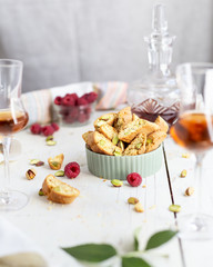 biscotti - italian cookies with pistachios, raspberries, a glass of brandy