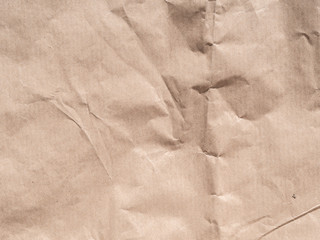 Top view beige crumpled wrapping paper background texture