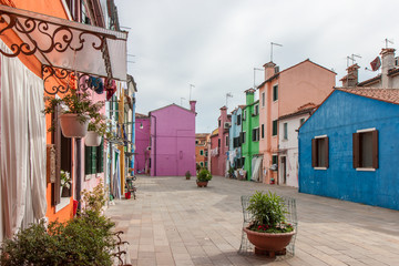Fototapeta na wymiar Colorful Buildings Along Street in Burano in Venice