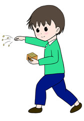豆まきをする男の子