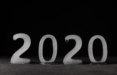 2019 text wrtiten with ice characters melting. Year of the global summit against global warming and representation of the end of the decade.