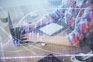 Multi exposure of forex graph with man working on computer on background. Concept of market analysis.