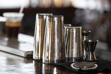 Shakers and various professional tools on the bar