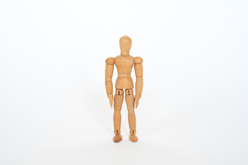 Wooden figure pose stand still on white background isolated object