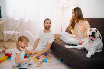 happy beautiful caucasian family spend holidays at home, together with children and domestic...