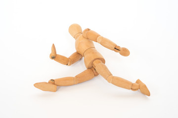 Wooden figure pose running on white background isolated object