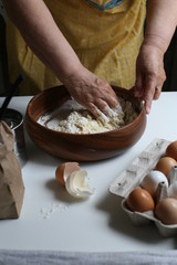  hands of a woman cooking homemade egg noodles
