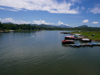 boat on river.Songkalia River, Sangkhlaburi, Kanchanaburi, Thailand. There are boats and houseboat in the river.