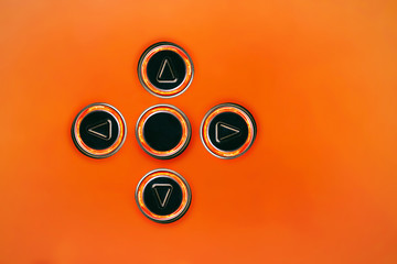 round buttons with luminous arrows in four directions