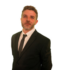 handsome and successful business man in suit and tie posing as CEO or manager of corporate company smiling elegant in career success and executive lifestyle