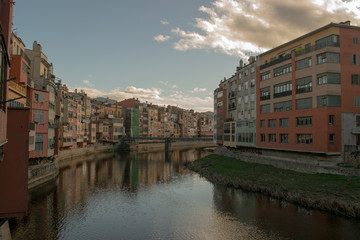 Colorful houses besides the banks of Riu Onyar, between the old town and the center of Girona (Spain).