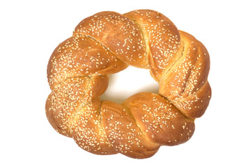 Twisted sweet bun with sesame seeds. Bakery isolated on white background