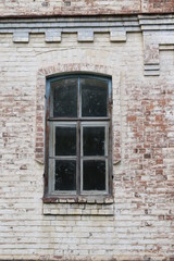 old window in brick wall