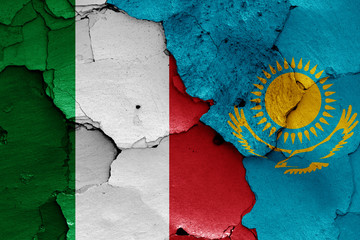 flags of Italy and Kazakhstan painted on cracked wall