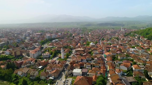 Old town of Gjakova in Kosovo, Aerial establishing shot of traditional buildings in picturesque scene 