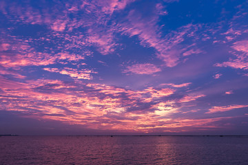 Naklejka na ściany i meble twilight sunset sky and beautiful cloud over sea, background concept.