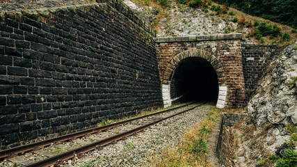 Fototapeta na wymiar railway tunel in slovak mountains national park, autumn colour in forerst