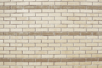 Old beige brick wall background