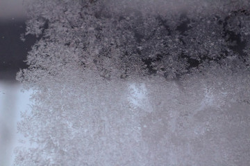 Closeup of rime ice on glass window