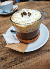 Close up coffee cup with coffe beams on foam