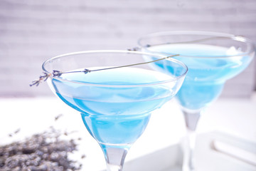 Lavender Lemonade or cocktail and lavender bouquet. Natural refreshing summer drink.