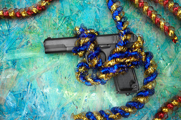 handgun decorated with tinsel