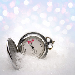 Clock lying in the snow
