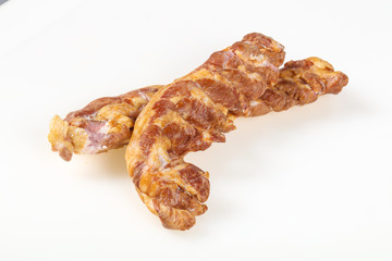 Smoked pork meat over white background