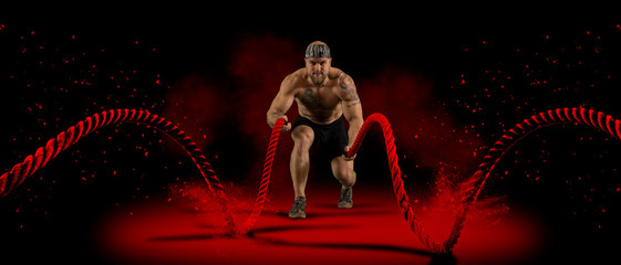 Man working out with battle ropes