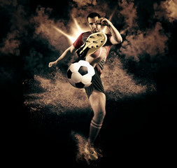 Soccer player in action on dark