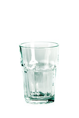 An empty glass glass and a carafe for water stand on a white background