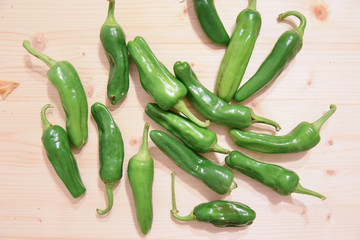 Green Peppers on Wooden Table