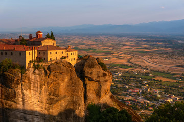 Monastery on a mountain and a city in Greece close up