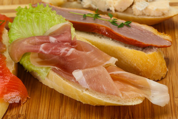 Tapas - bruschetta with prosciutto, salmon, duck and gorgonzola