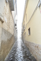 Fototapeta premium Ancient Houses and Buildings in Troia, Foggia, Italy, at Morning with Foggy Weather