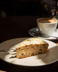 coffee and cake on table. Sunny day.