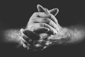 two hands expressing commitment, in black and white