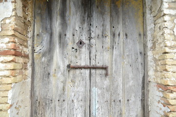 Old wooden door with peeling paint