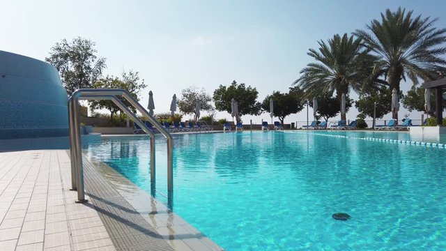 Beautiful luxury outdoor swimming pool in resort in Dubai.