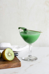 Green cocktail with kiwi fruit, vodka, Prosecco or Champagne