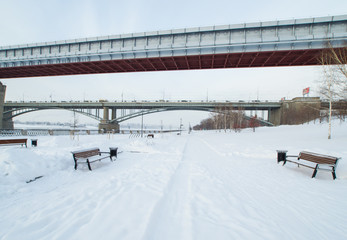 seafront covered with snow in winter and bridges over the river