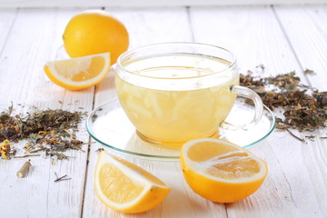 Still life with lemon, ginger and honey on a white background