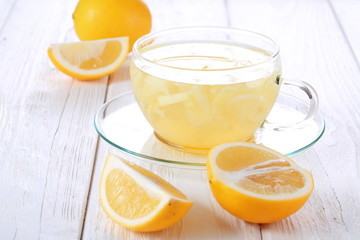 Still life with lemon, ginger and honey on a white background