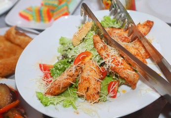 Caesar salad on the festive table