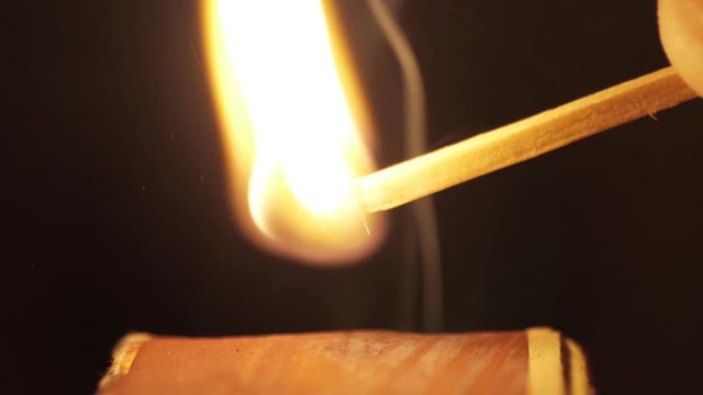 lighting a match macro shot slow motion