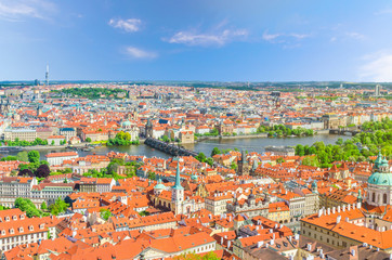 Obraz premium Top aerial panoramic view of Prague historical city centre with red tiled roof buildings in Mala Strana Lesser Town and Old Town, Charles Bridge Karluv Most over Vltava river, Bohemia, Czech Republic